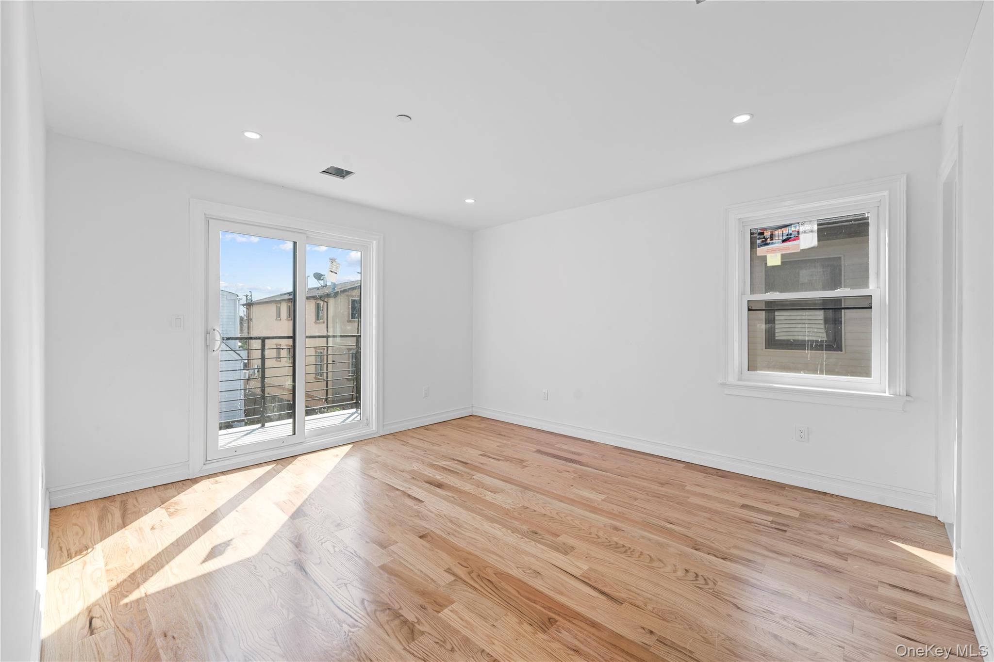 258-10 147th Road Queens, NY 11422 - Photo 18 of 26 Spare room featuring light wood finished floors and recessed lighting