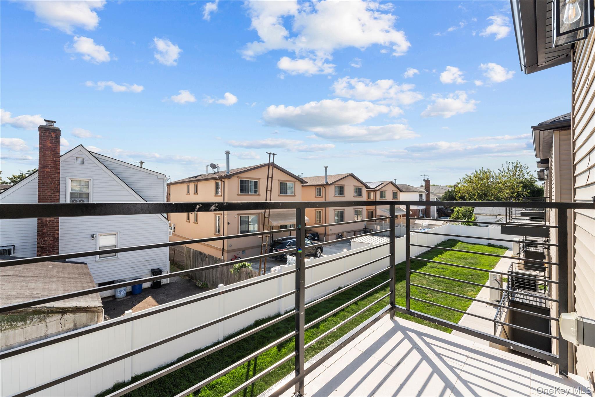 258-10 147th Road Queens, NY 11422 - Photo 19 of 26 Balcony with a residential view