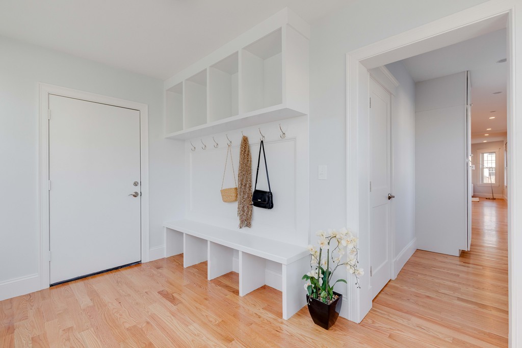 57 Katherine Road, Unit 57 Watertown, MA 02472 - Photo 11 of 30 a view of entryway and hall with wooden floor