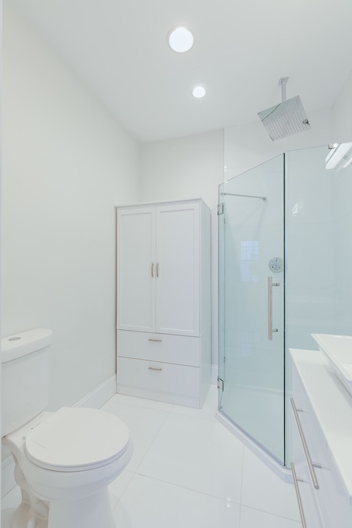 57 Katherine Road, Unit 57 Watertown, MA 02472 - Photo 18 of 30 a bathroom with a toilet and a shower