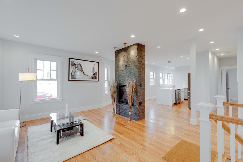 57 Katherine Road, Unit 57 Watertown, MA 02472 - Photo 3 of 30 a living room with furniture and a wooden floor
