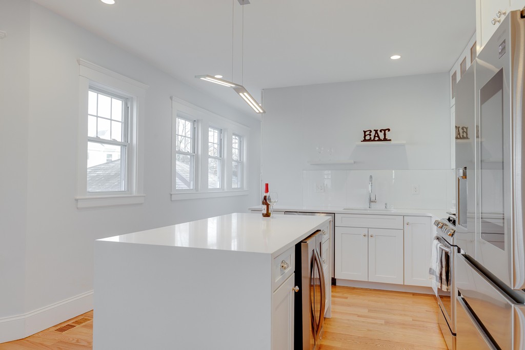 57 Katherine Road, Unit 57 Watertown, MA 02472 - Photo 9 of 30 a kitchen with a sink cabinets and window