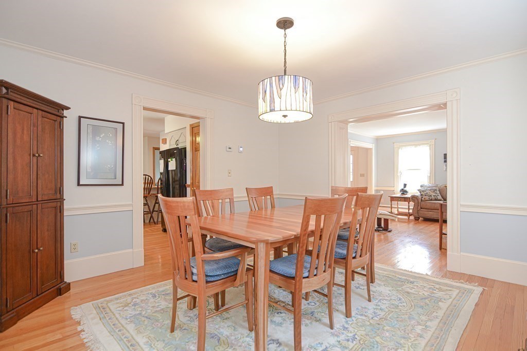 27 Wilson Pond Road Rowley, MA 01969 - Photo 24 of 42 a view of a dining room with furniture and wooden floor