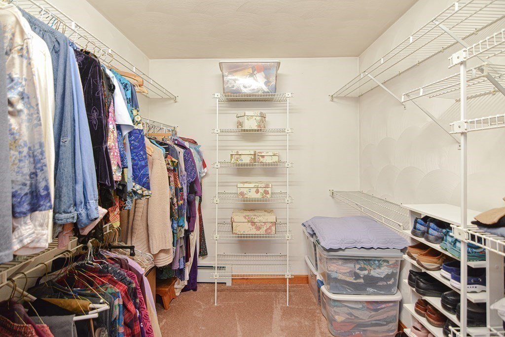 27 Wilson Pond Road Rowley, MA 01969 - Photo 30 of 42 a view of walk in closet with clothes and shoes