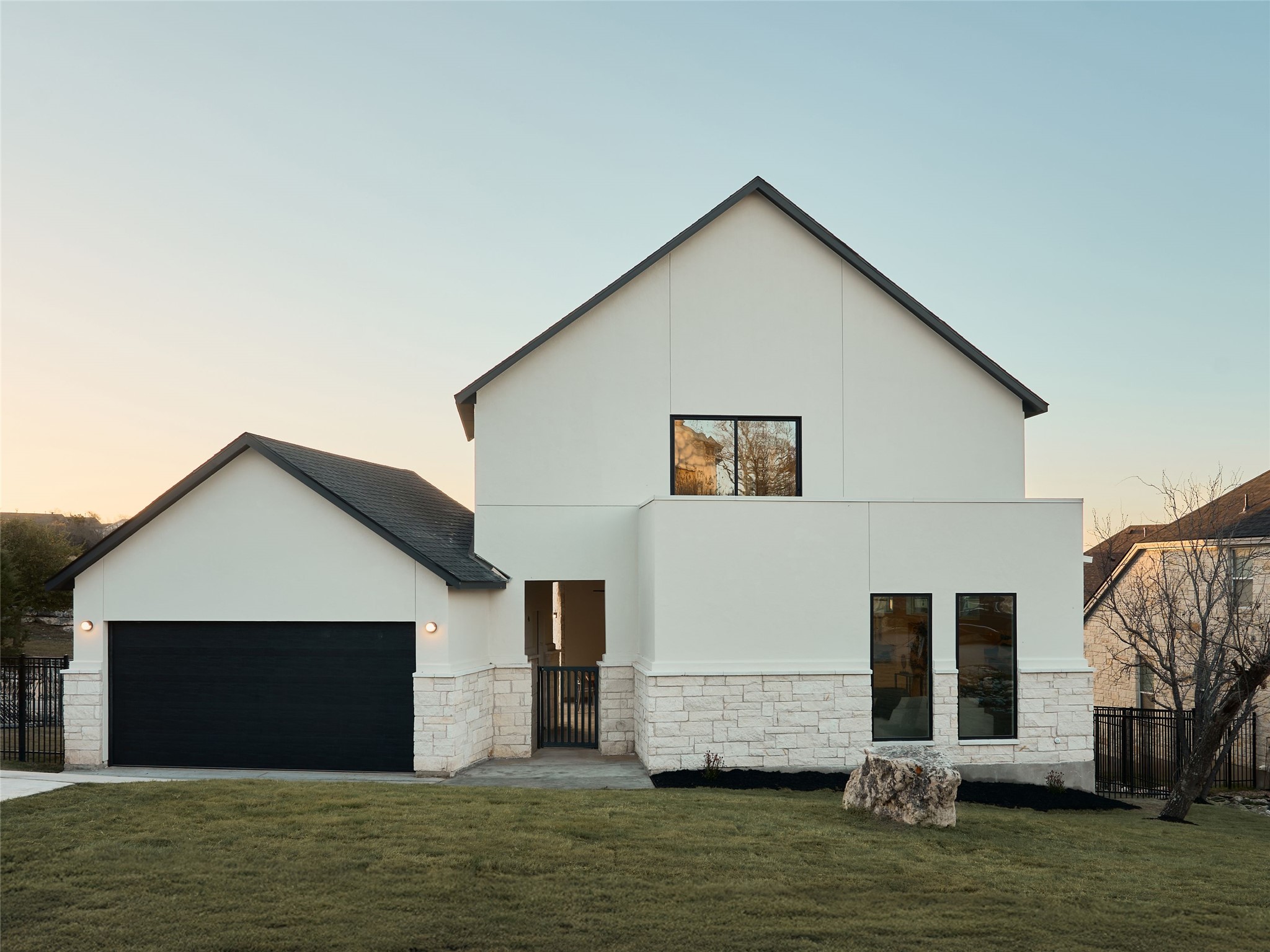 2100 Bighorn Leander, TX 78641 - Photo 2 of 36 Contemporary home with stone siding, stucco siding, and driveway