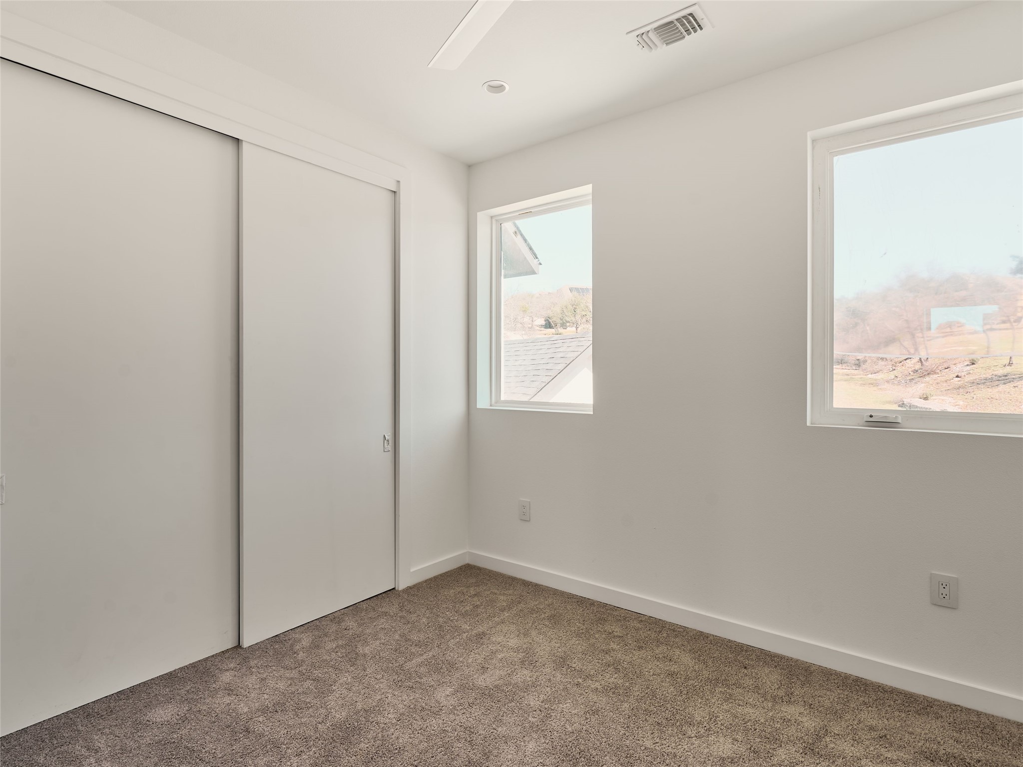 2100 Bighorn Leander, TX 78641 - Photo 27 of 36 Unfurnished bedroom featuring a closet, carpet, and ceiling fan