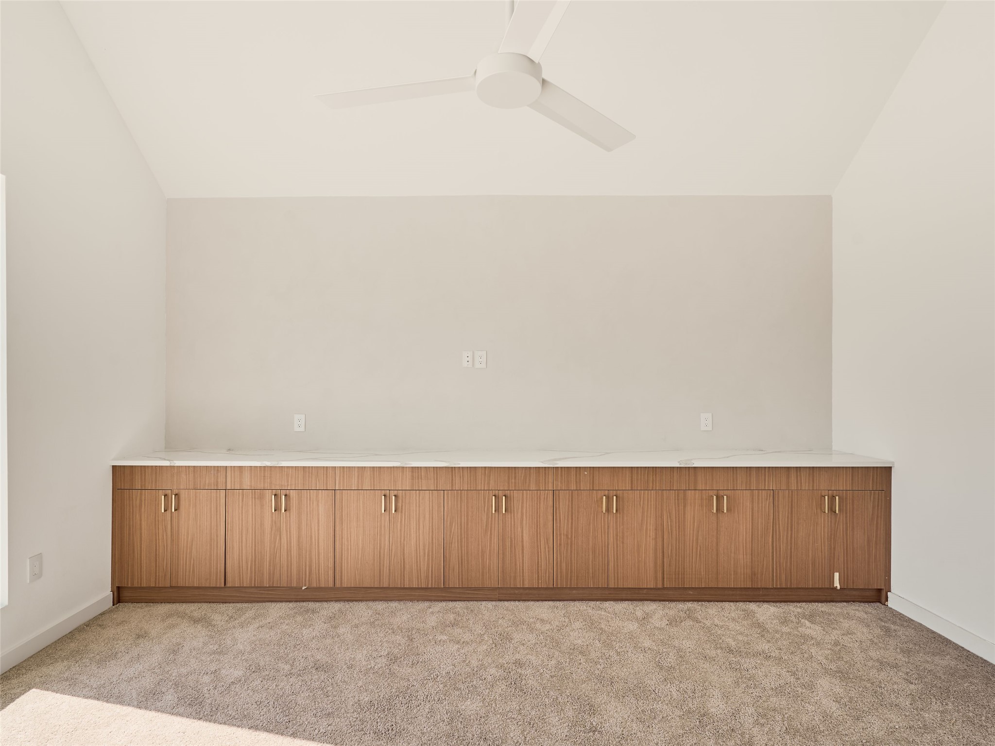 2100 Bighorn Leander, TX 78641 - Photo 30 of 36 Empty room with vaulted ceiling, light colored carpet, and ceiling fan