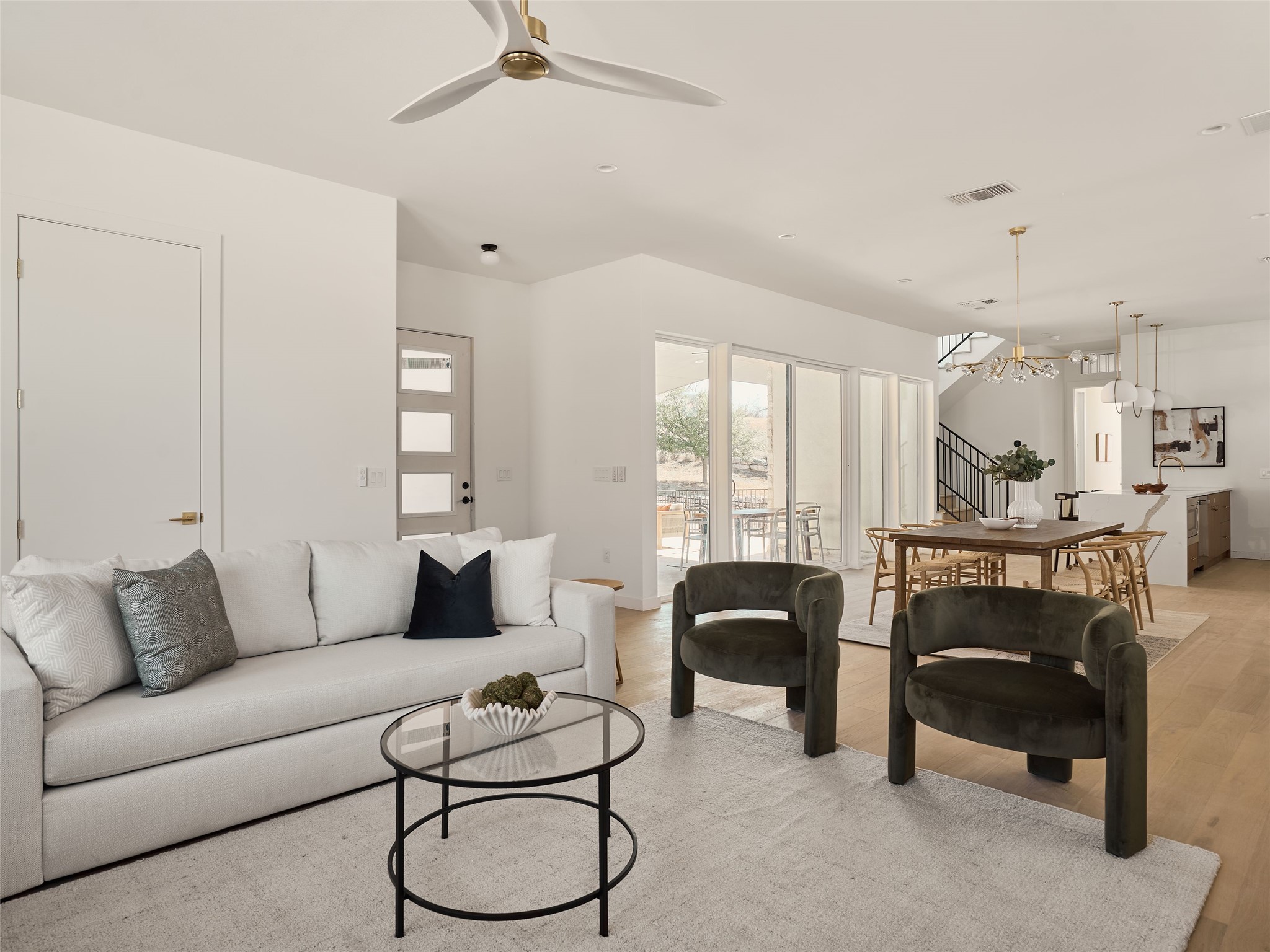 2100 Bighorn Leander, TX 78641 - Photo 5 of 36 Living room with wood finished floors, ceiling fan, and a chandelier