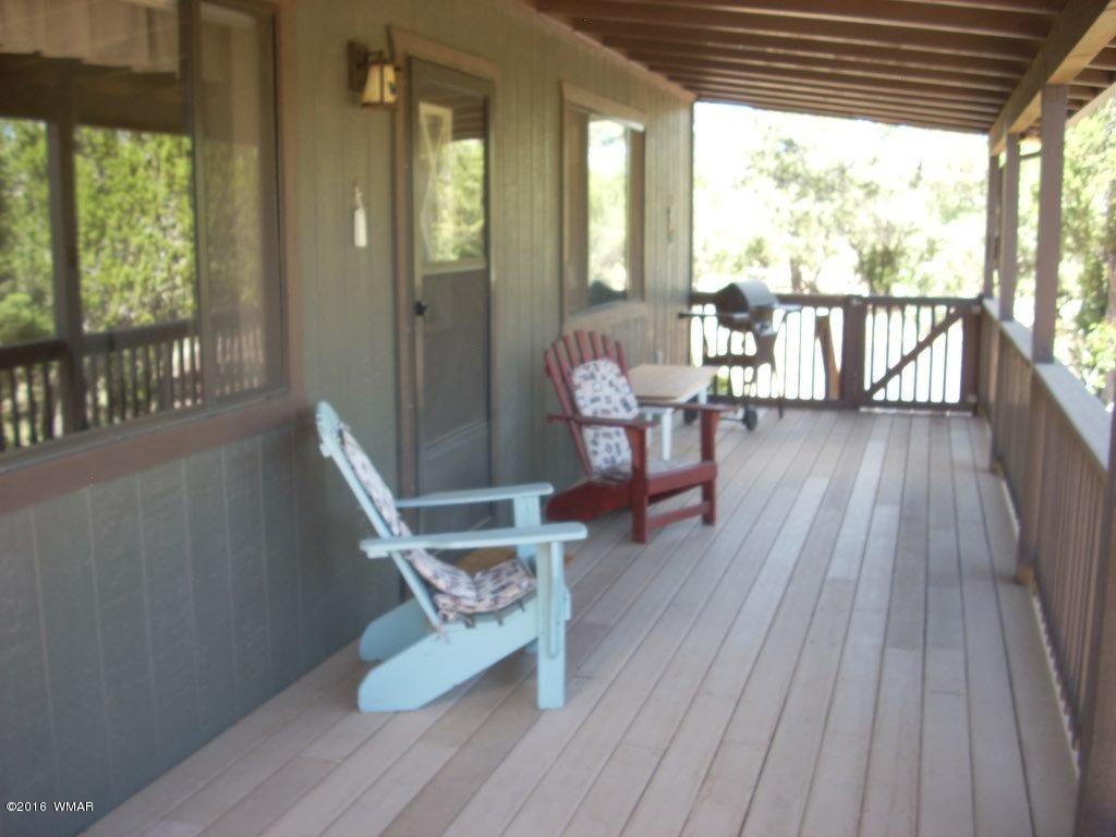 3145 Aspen Road Overgaard, AZ 85933 - Photo 14 of 36 a living room with furniture and a wooden floor