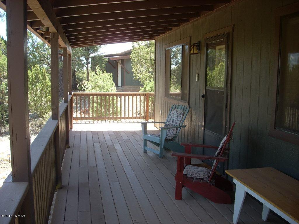 3145 Aspen Road Overgaard, AZ 85933 - Photo 15 of 36 a view of balcony with furniture and wooden floor