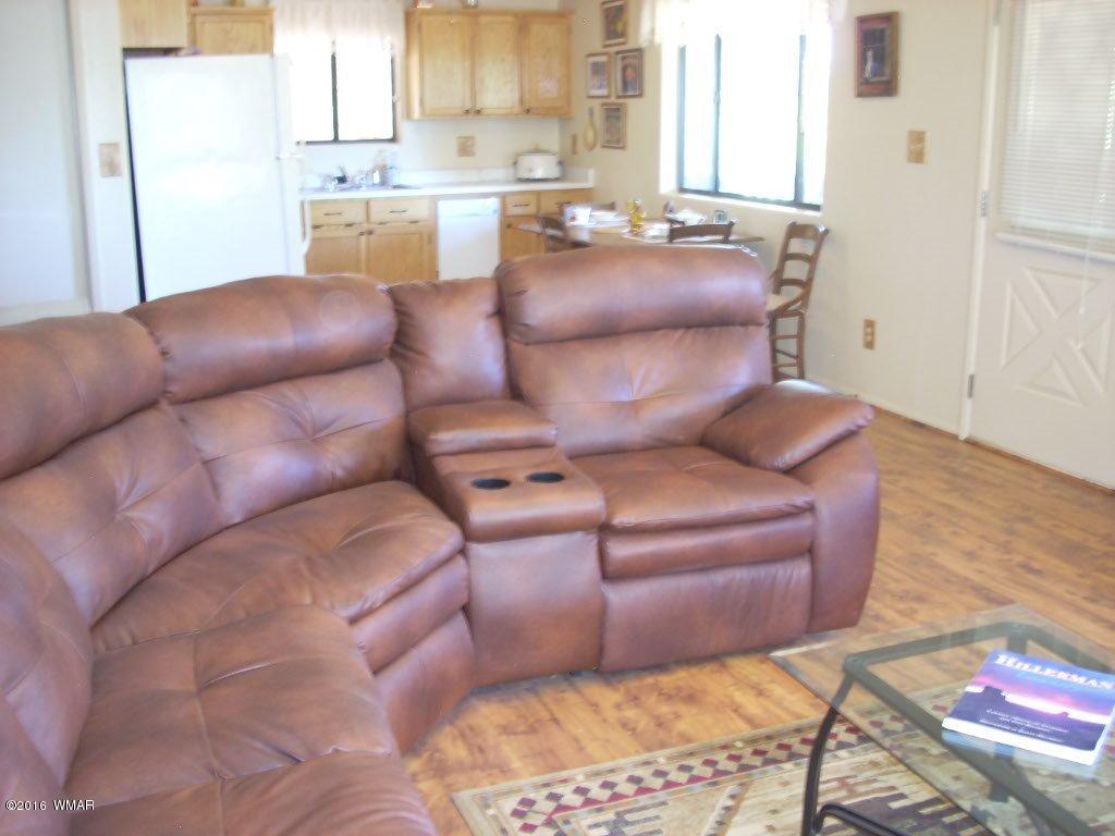 3145 Aspen Road Overgaard, AZ 85933 - Photo 19 of 36 a living room with furniture and a couch