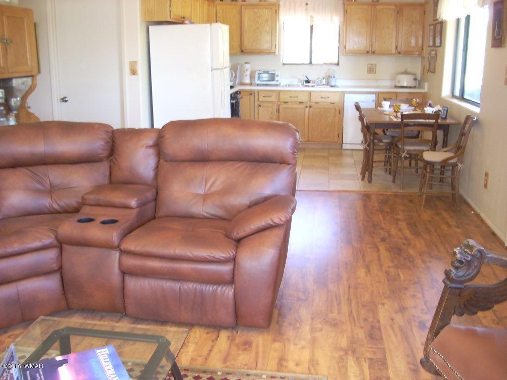 3145 Aspen Road Overgaard, AZ 85933 - Photo 20 of 36 a living room with furniture and a large window
