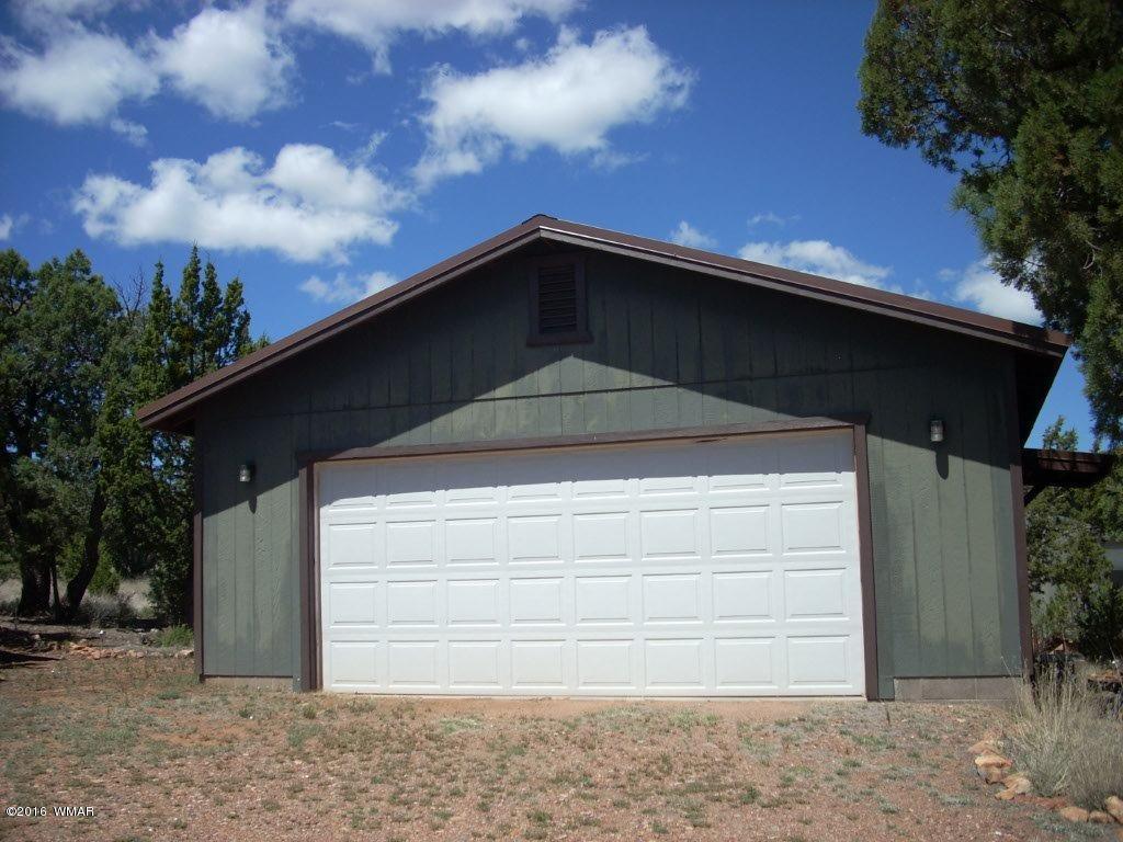 3145 Aspen Road Overgaard, AZ 85933 - Photo 2 of 36 a front view of a house