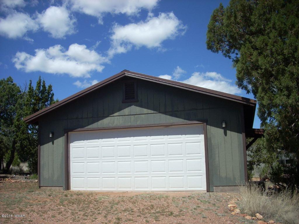 3145 Aspen Road Overgaard, AZ 85933 - Photo 3 of 36 a front view of a house