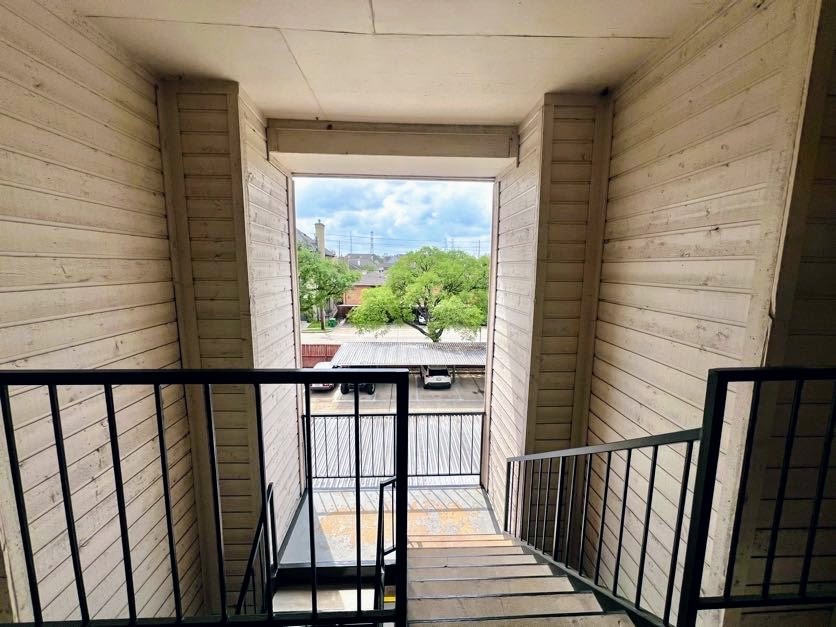 4041 Drake Street, Unit 118 Houston, TX 77005 - Photo 21 of 22 a view of a balcony with wooden floor