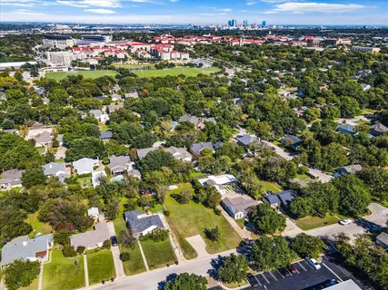 an aerial view of residential houses with outdoor space