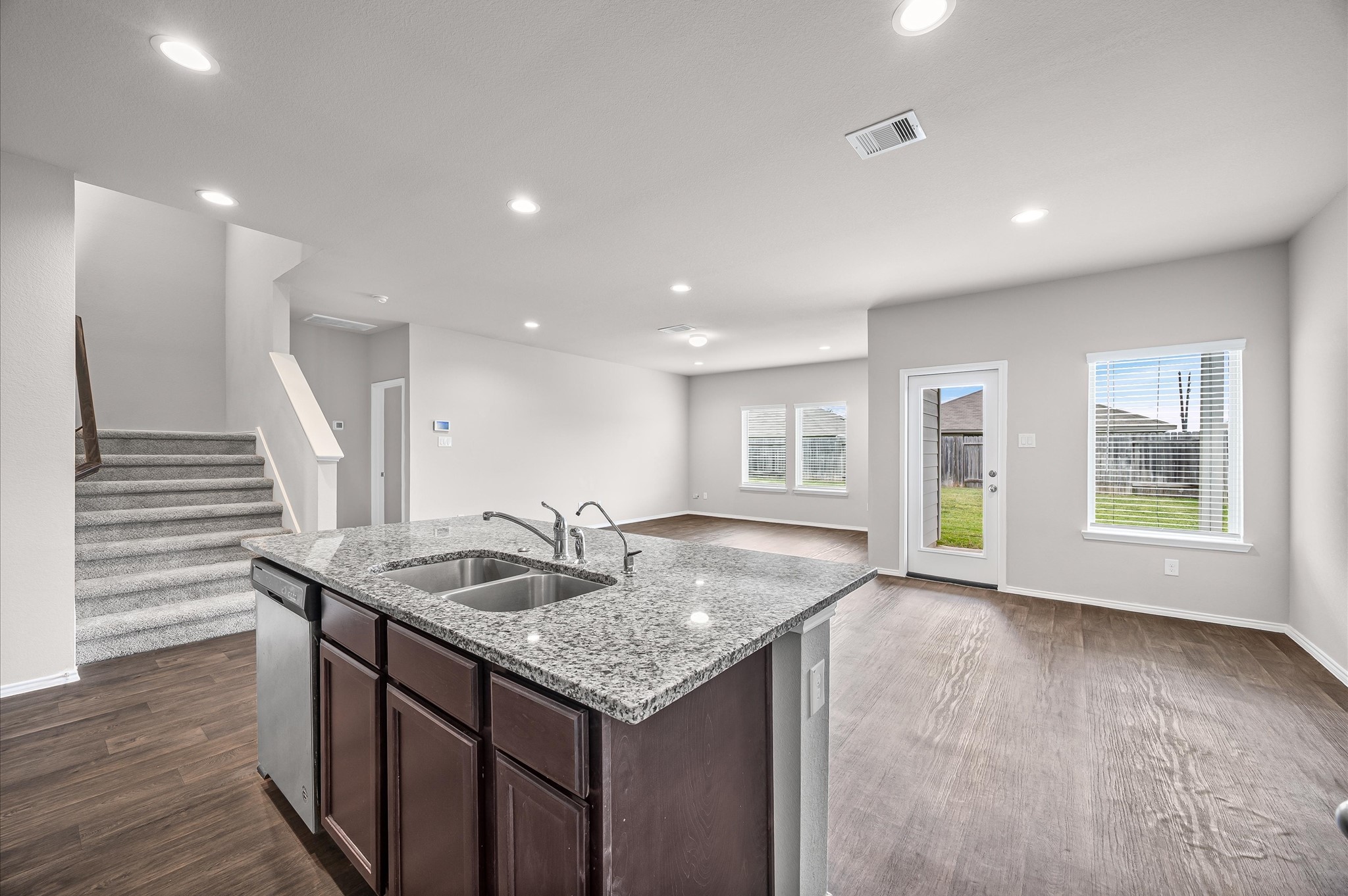 23522 Wedgewood Cliff Way Spring, TX 77373 - Photo 8 of 30 a kitchen with a sink and wooden floor