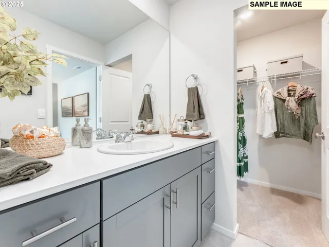 a bathroom with a double vanity sink and a mirror