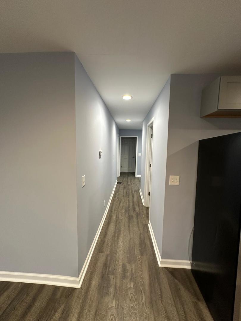 307 Grant Street Harvard, IL 60033 - Photo 12 of 18 a view of hallway with wooden floor