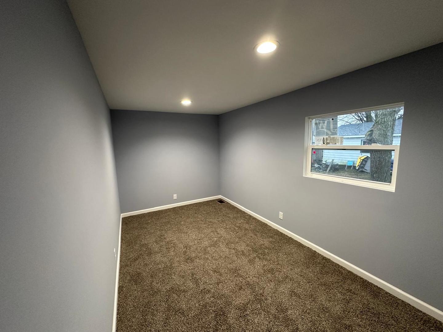 307 Grant Street Harvard, IL 60033 - Photo 14 of 18 an empty room with a window