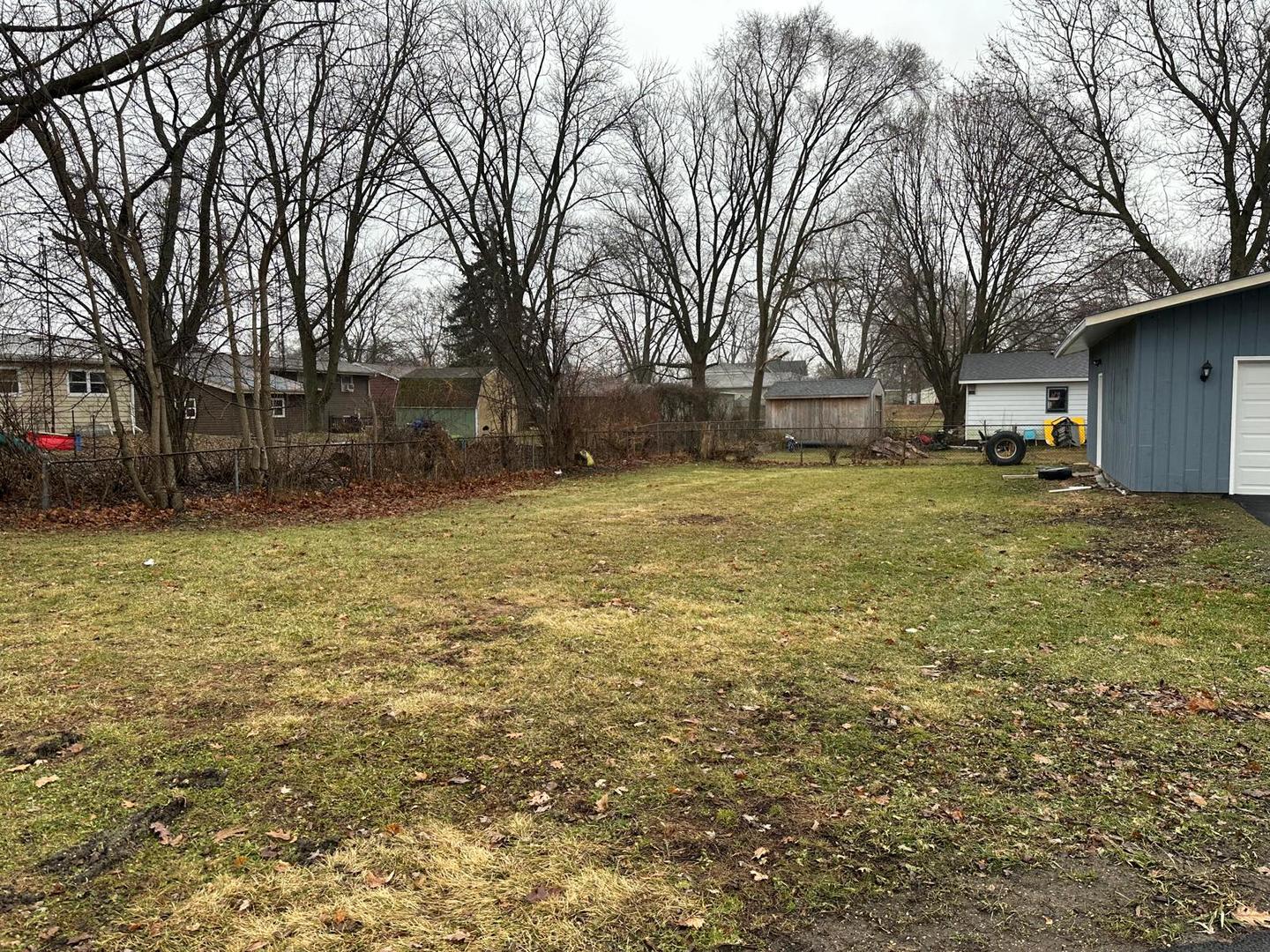307 Grant Street Harvard, IL 60033 - Photo 2 of 18 a backyard of a house with lots of green space