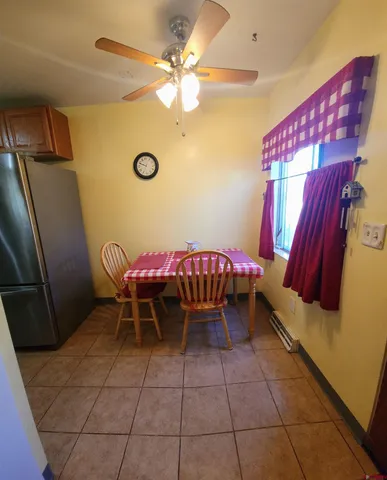 a dining room with a table and chairs