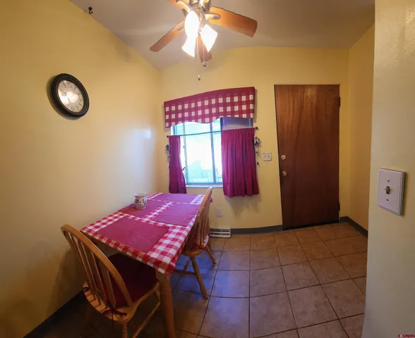a view of a room with furniture and chandelier