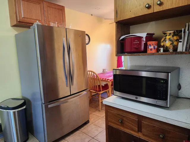 a kitchen with stainless steel appliances a refrigerator and a stove