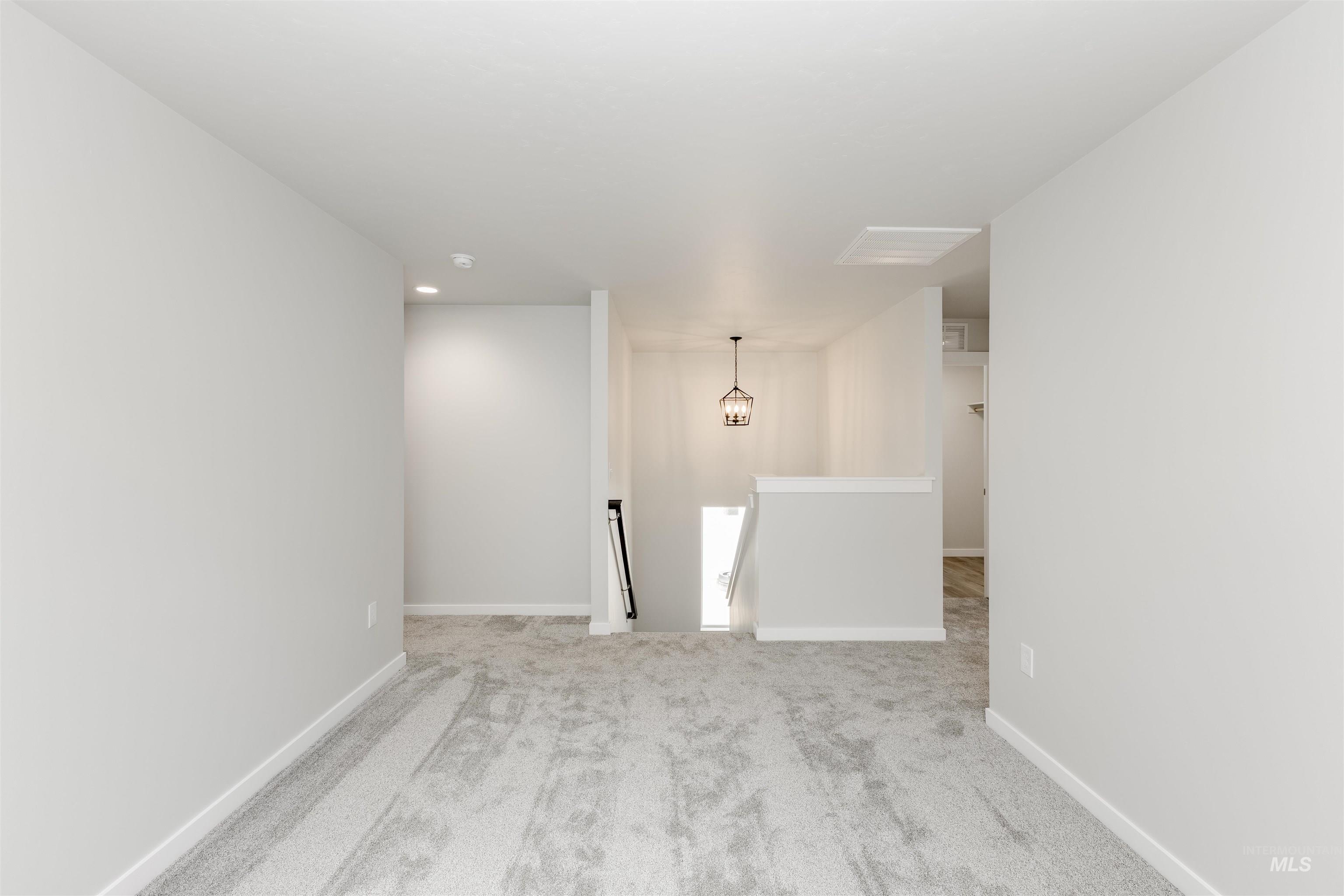 10865 Rutland Street Caldwell, ID 83605 - Photo 10 of 20 Spare room with carpet floors and recessed lighting