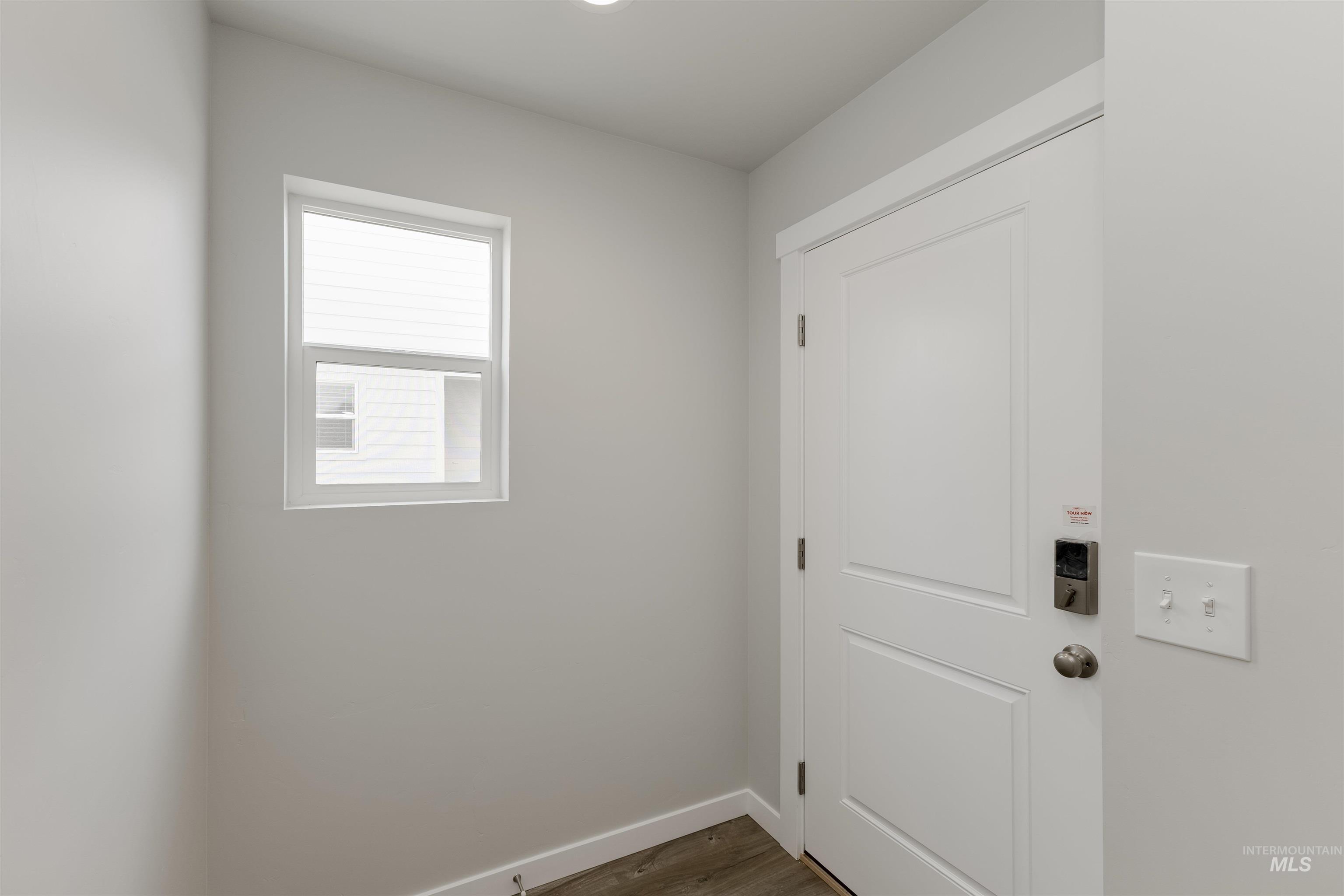 10865 Rutland Street Caldwell, ID 83605 - Photo 2 of 20 Washroom with dark wood-style flooring and baseboards