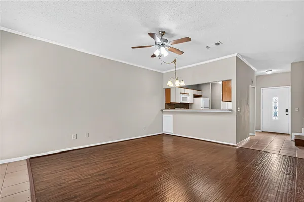 a bathroom with a granite countertop toilet sink and mirror