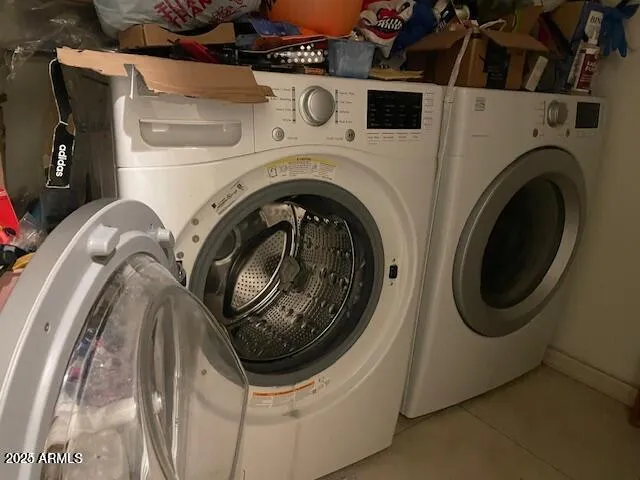 a utility room with dryer and washer