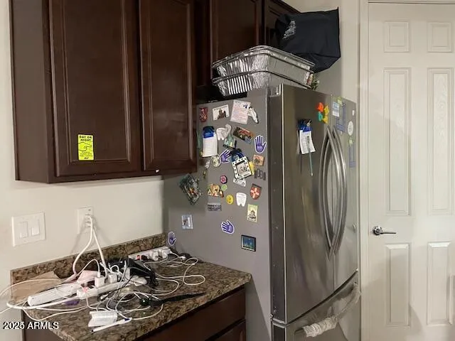 a kitchen with a stove and a refrigerator