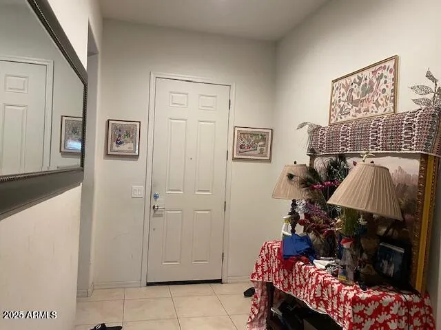 a bedroom with furniture and a baby crib