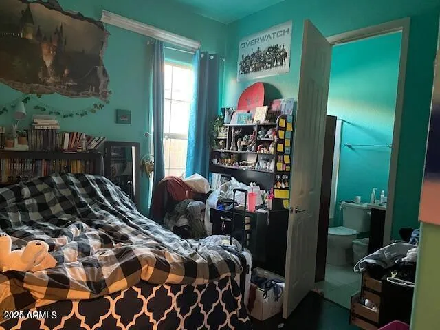 a bedroom with a bed and a closet