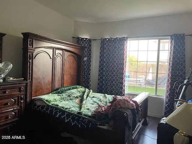 a bedroom with a bed and a dresser