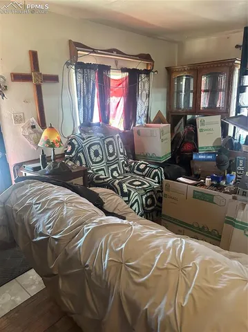 a bedroom with double bed and a window