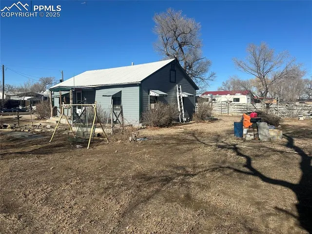 a view of a house with a snow on the road