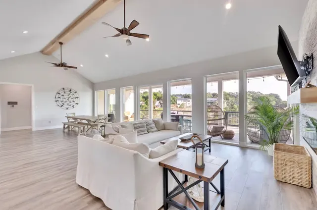a very nice looking living room with furniture and a large window