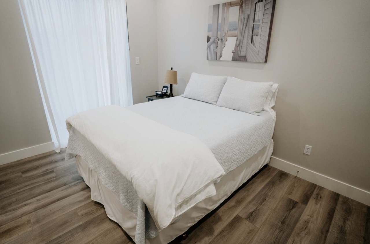 16323 Lake Loop Austin, TX 78734 - Photo 13 of 37 a bedroom with a bed and a window