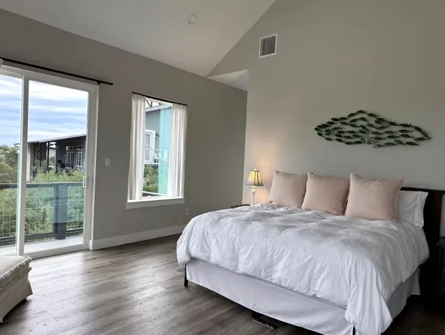 a bedroom with a bed and window