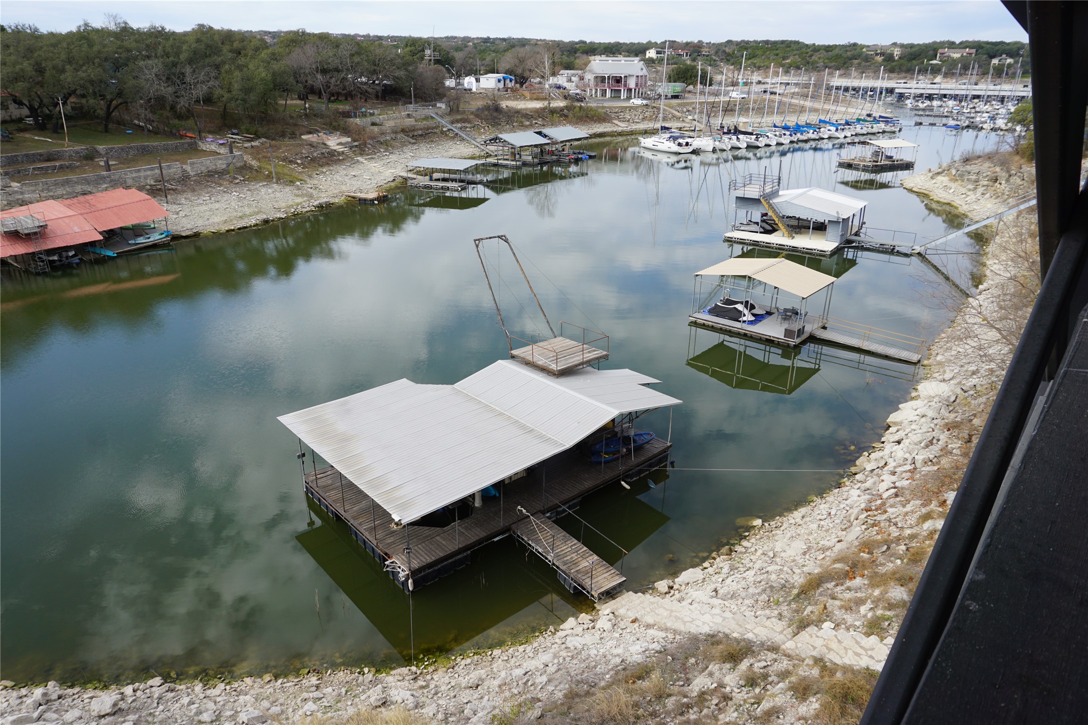 16323 Lake Loop Austin, TX 78734 - Photo 21 of 37 a view of a lake with tall buildings
