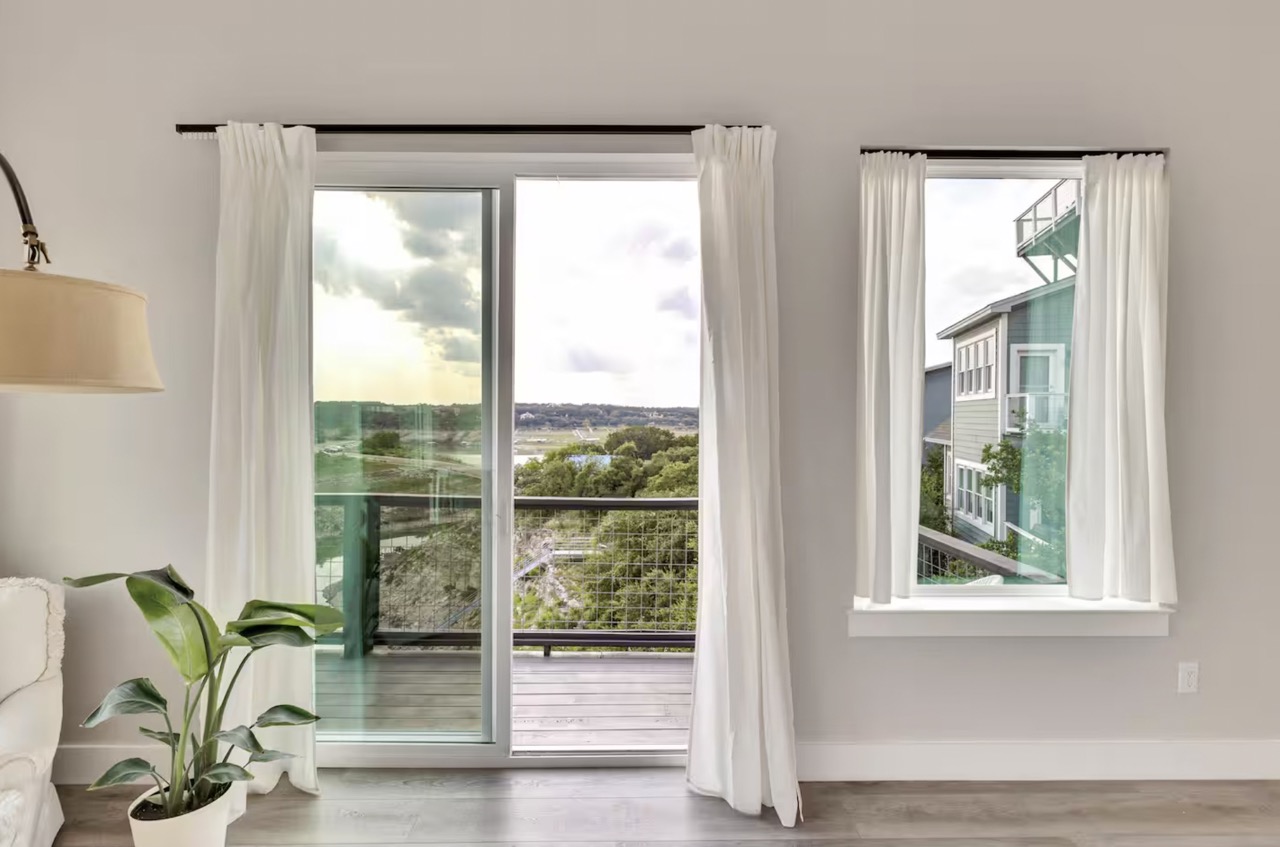 16323 Lake Loop Austin, TX 78734 - Photo 23 of 37 a view of a room that has a large window and wooden floor