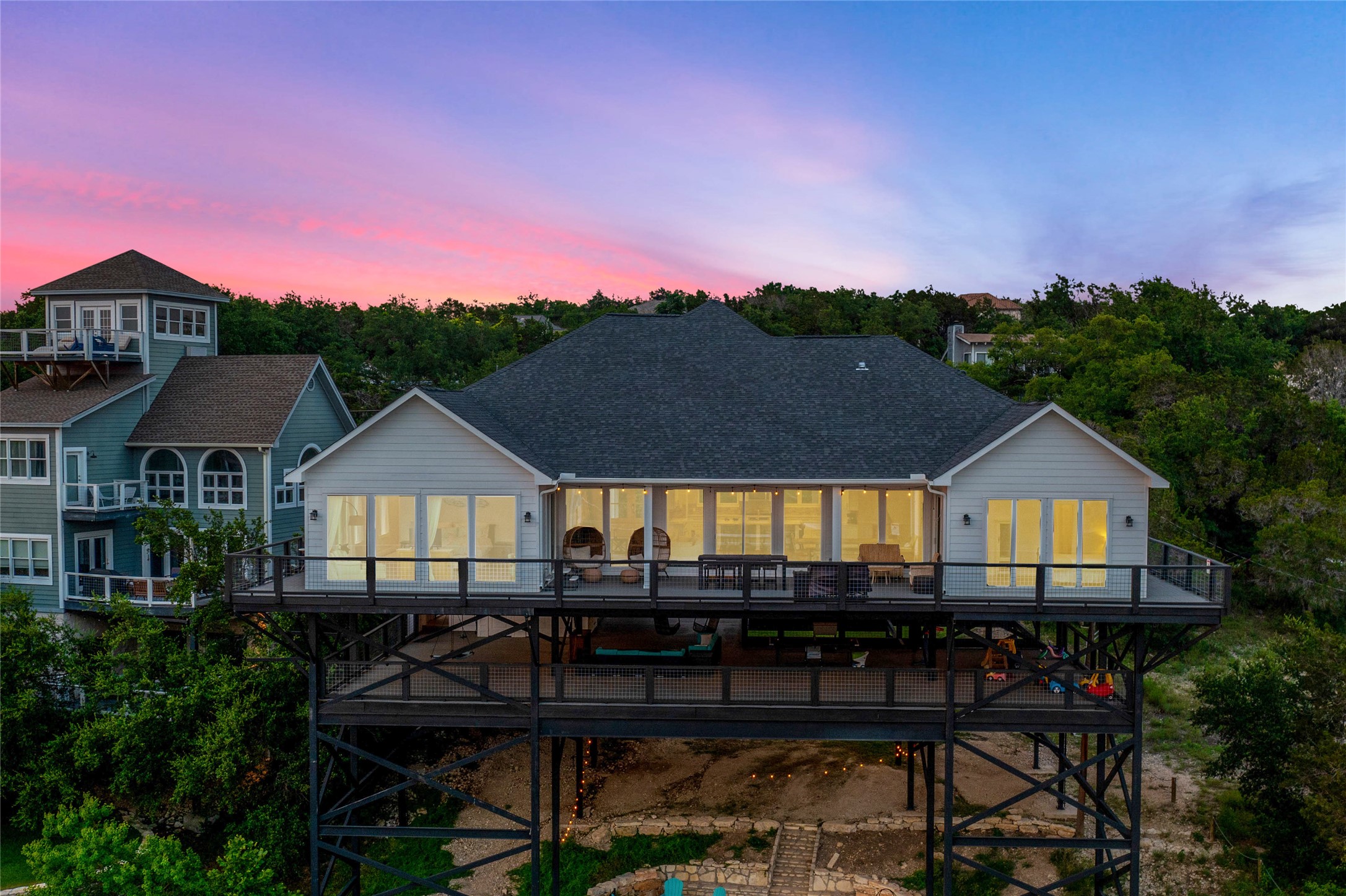 16323 Lake Loop Austin, TX 78734 - Photo 24 of 37 a front view of a house with a yard and furniture
