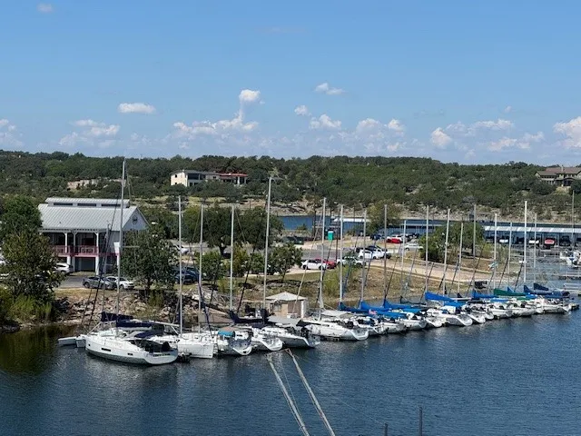 a view of a lake with boats and trees