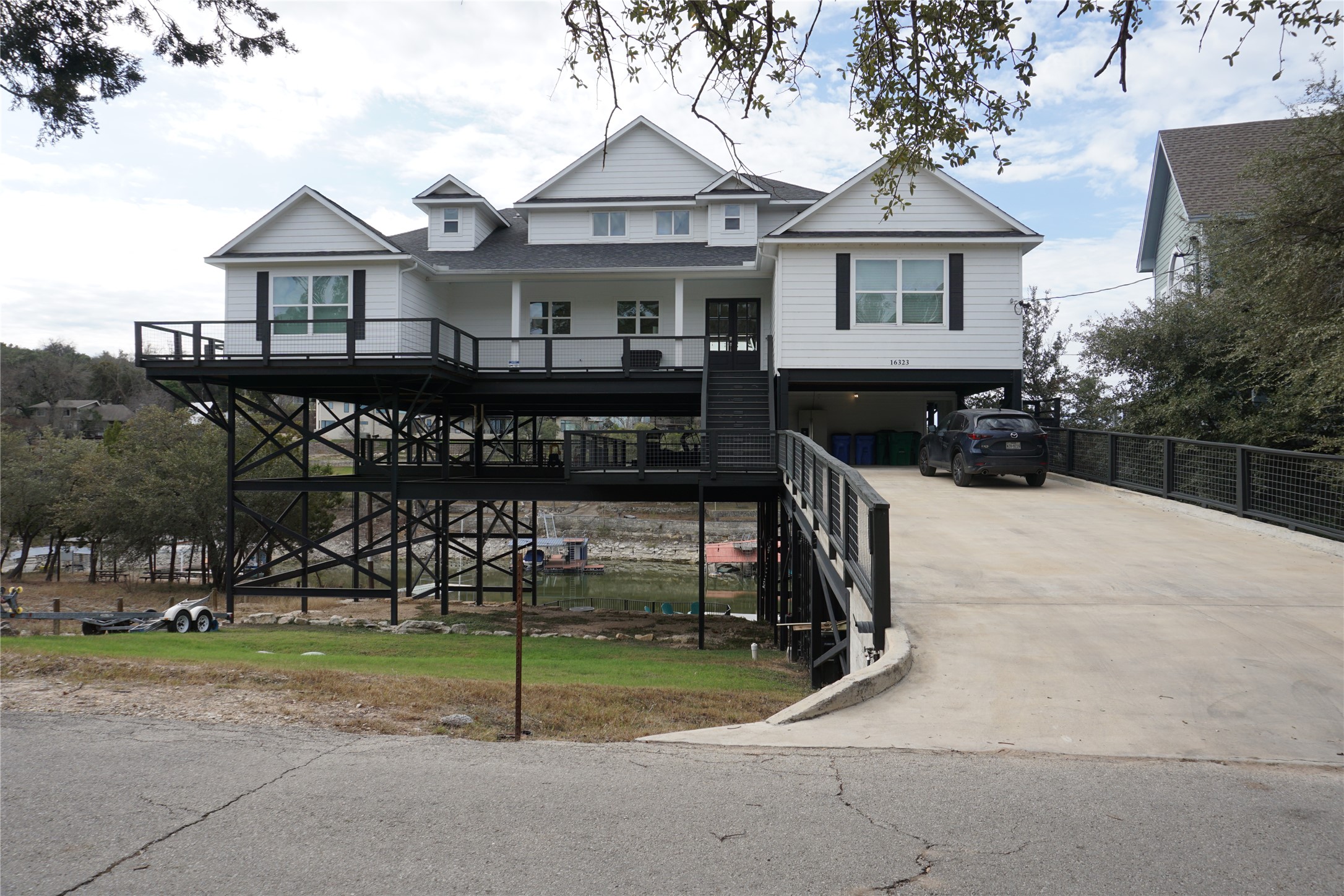 16323 Lake Loop Austin, TX 78734 - Photo 35 of 37 a view of house with a yard
