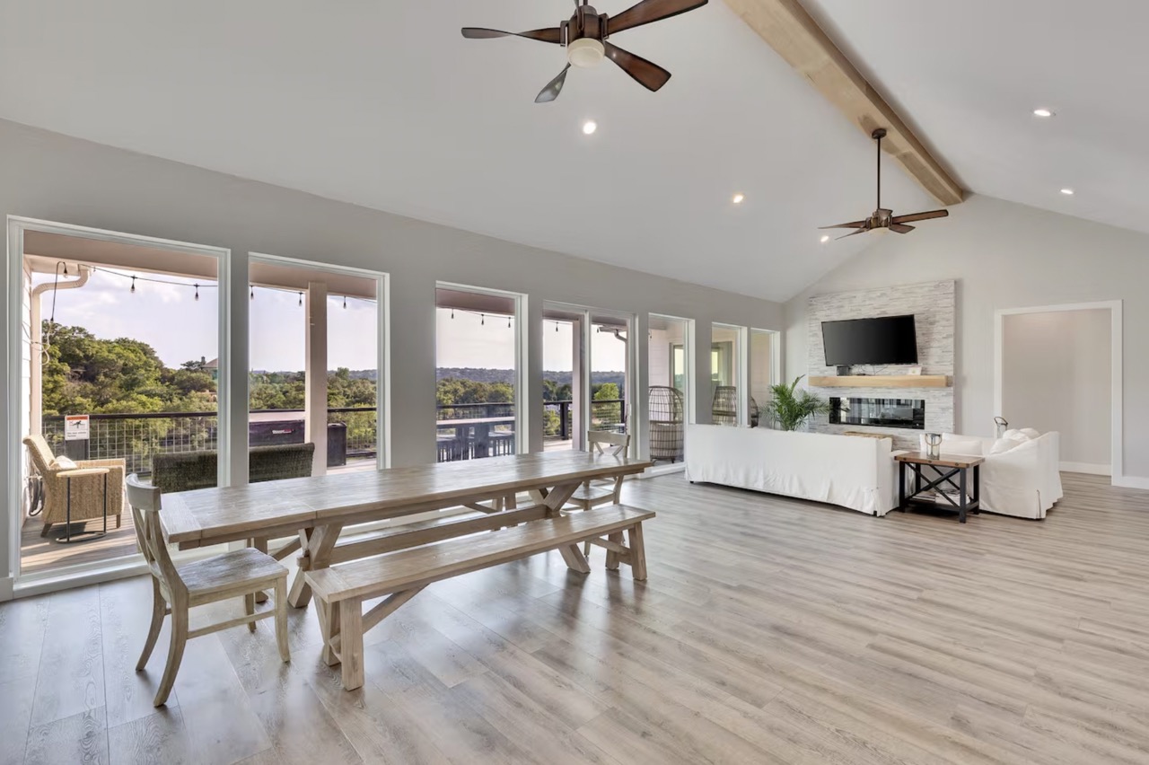 16323 Lake Loop Austin, TX 78734 - Photo 5 of 37 a living room with furniture and a flat screen tv with wooden floor
