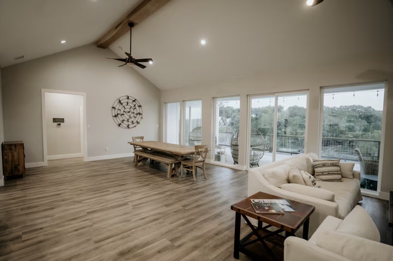 16323 Lake Loop Austin, TX 78734 - Photo 6 of 37 a living room with furniture and a wooden floor