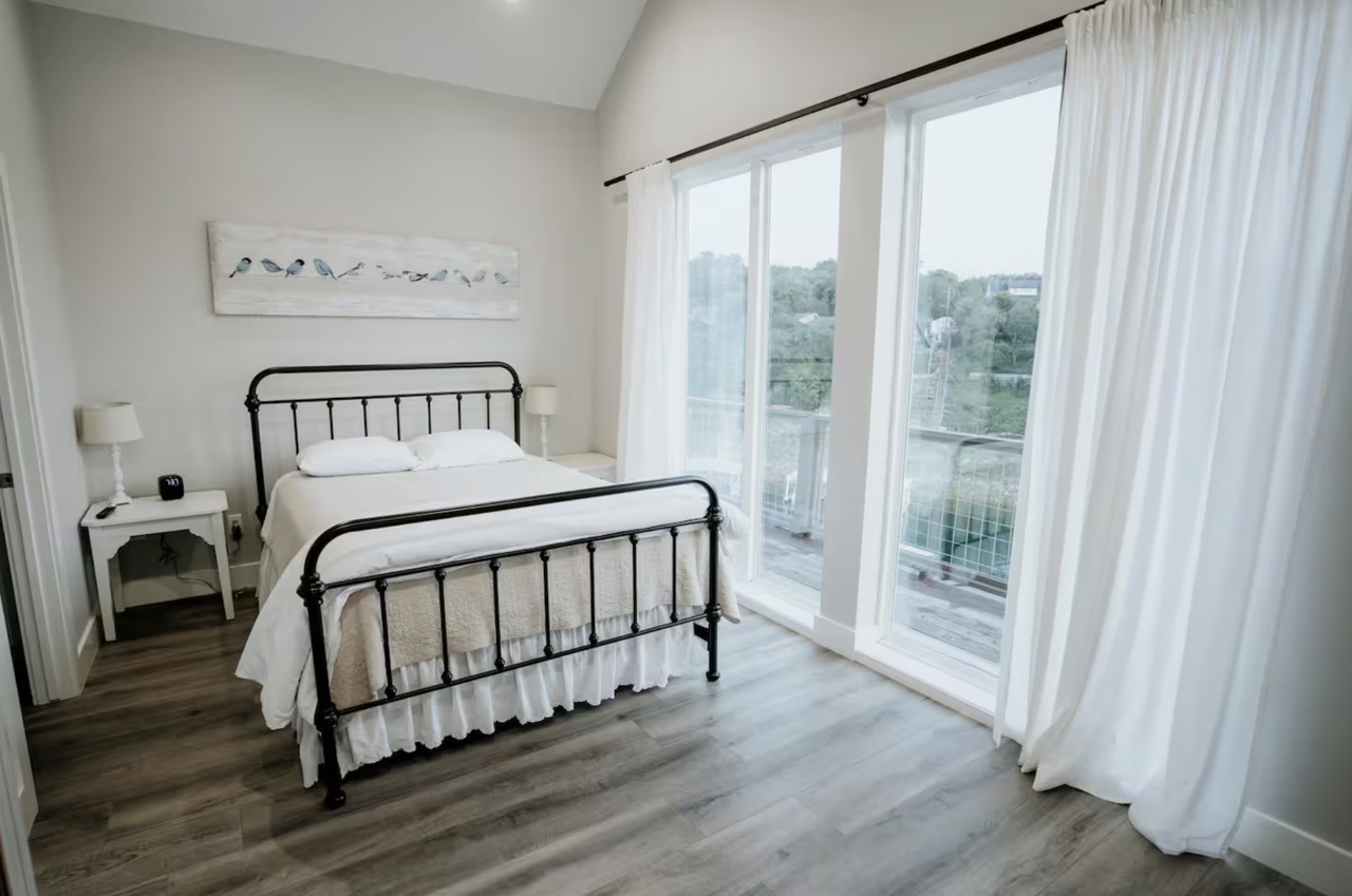 16323 Lake Loop Austin, TX 78734 - Photo 10 of 37 a bedroom with a bed and a window