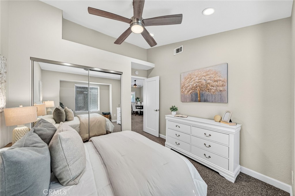 9290 Hot Springs Road Corona, CA 92883 - Photo 12 of 25 a bedroom with a bed and a dresser